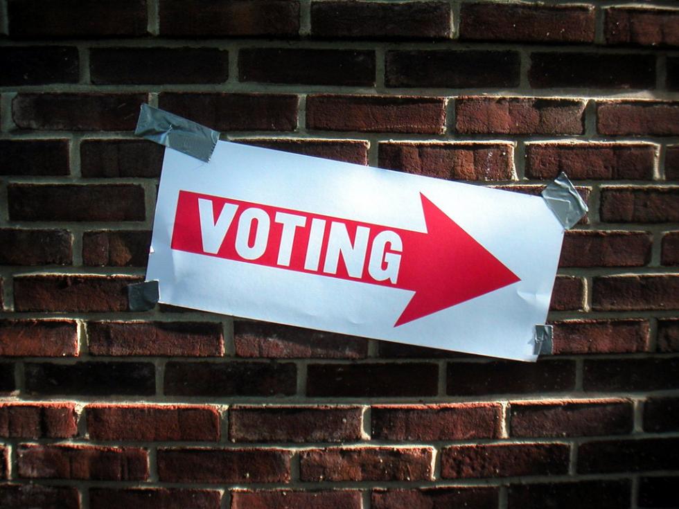 "voting" sign points to polling station